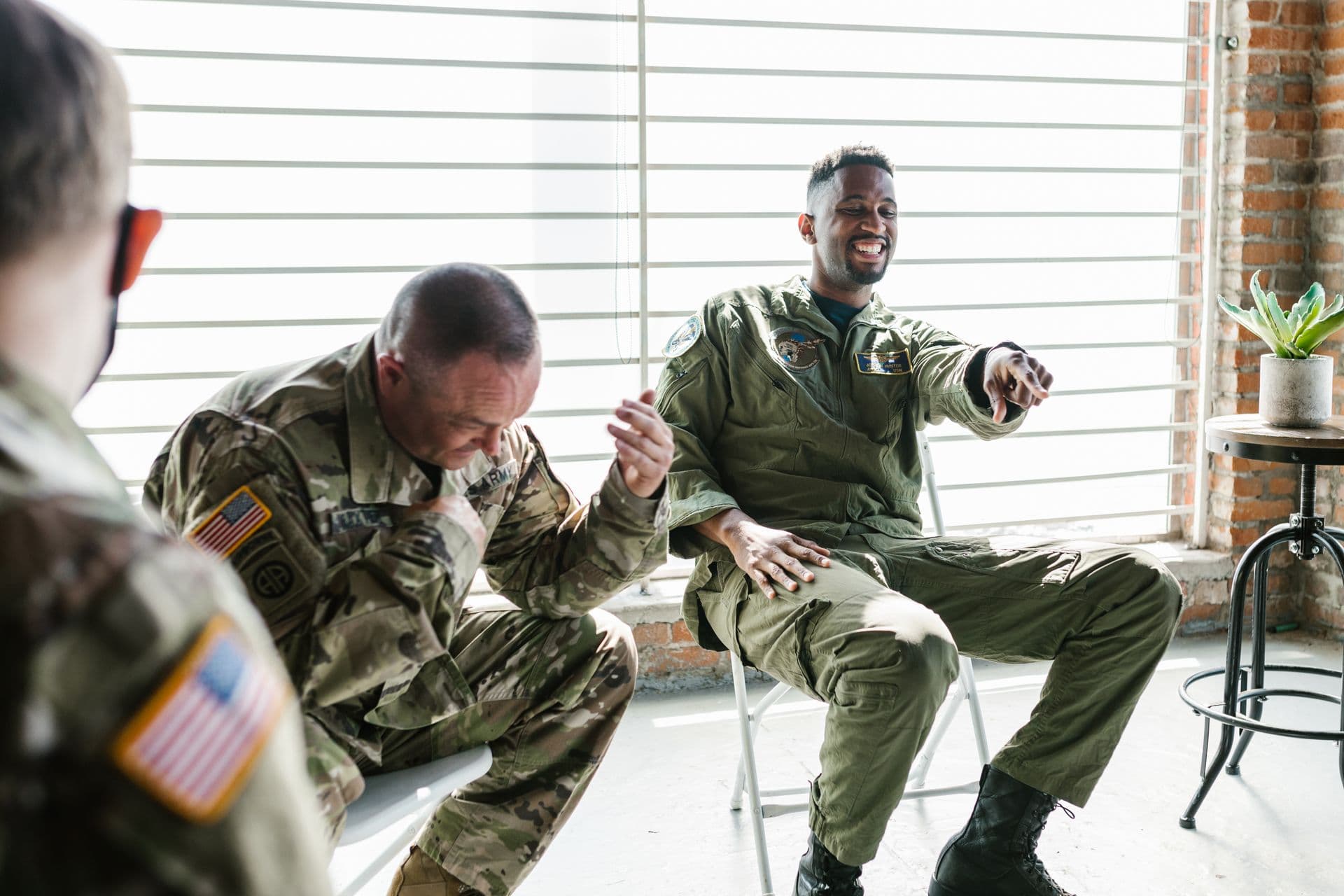Veterans from different services share a laugh together during a small-group session
